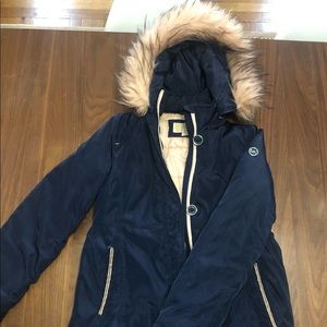 Navy blue coat with Faux Fur trim is light pink